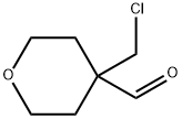 4-(chloromethyl)oxane-4-carbaldehyde